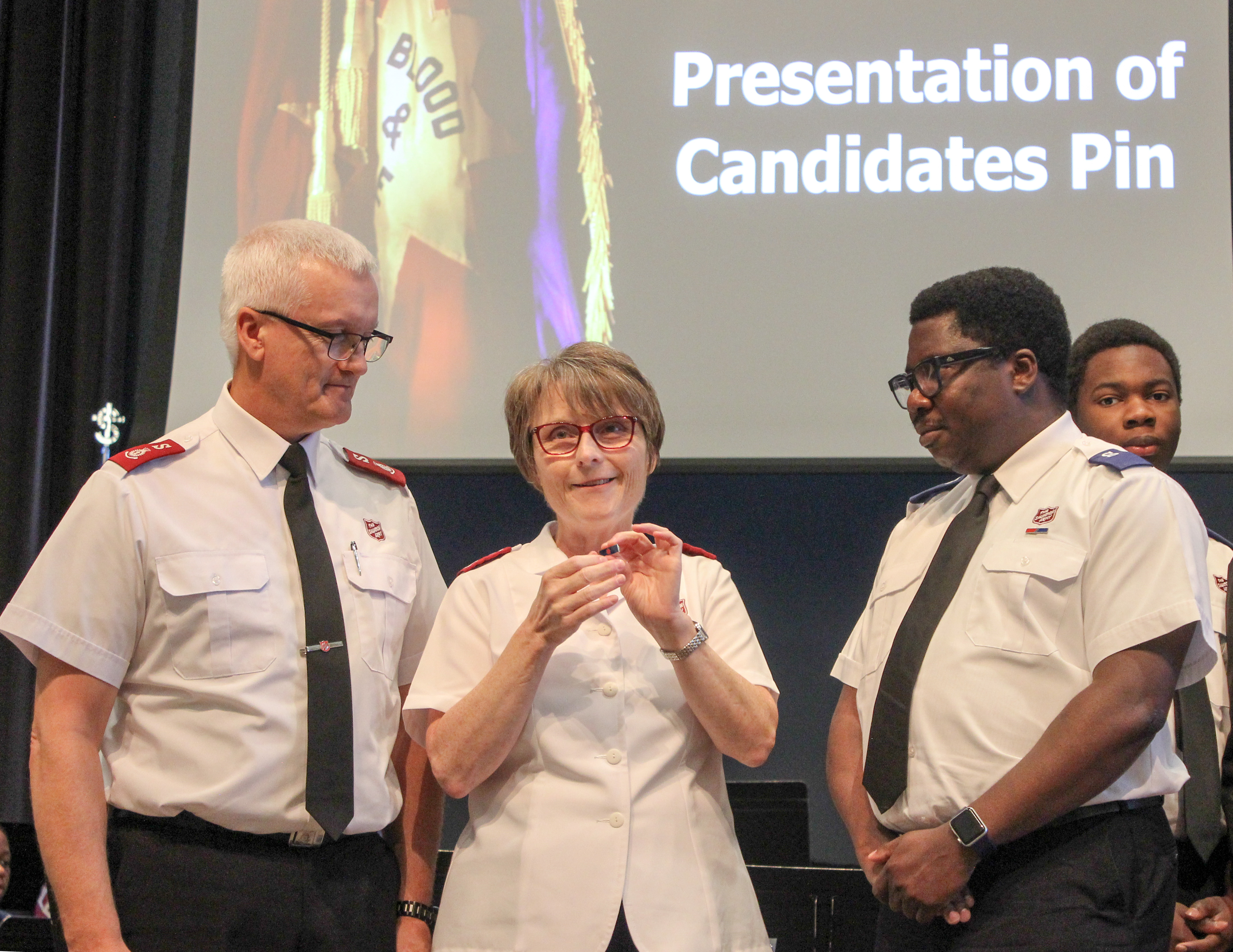 Lekan receiving his Accepted Candidates Pin
