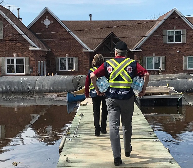 Two emotional and spiritual care workers visit flood-ravaged home